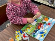 Keely doing a puzzle