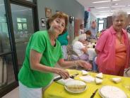 50+ Seniors serving food