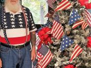 50+ Seniors by American flag Christmas tree